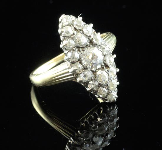 A late Victorian 18ct gold and marquise shaped diamond cluster ring, size J.